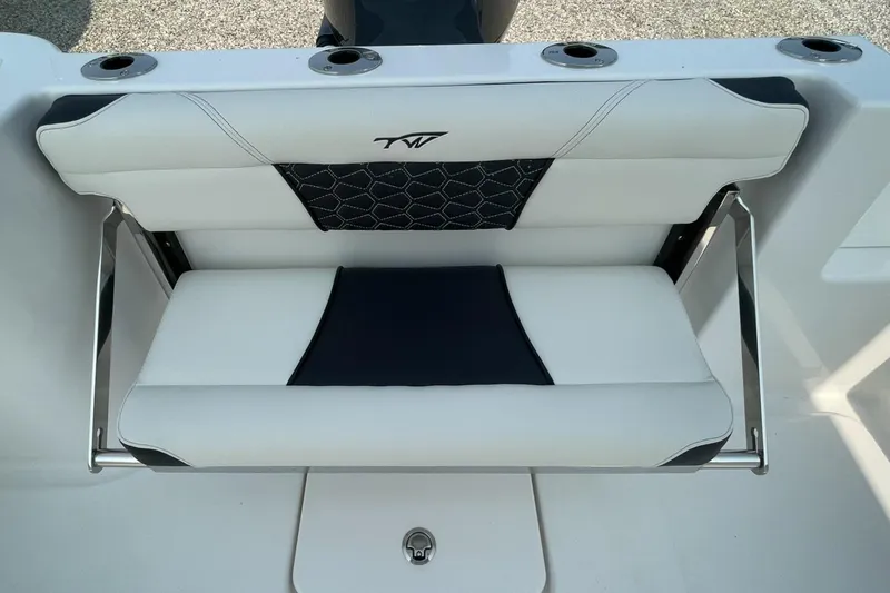 Slide: The Image of 2025 Tidewater 232 CC Adventure boat seat with sleek design and integrated rod holders. - 37