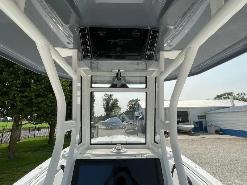 Slide: The Image of 2025 Tidewater 232 CC Adventure boat interior with advanced navigation system and sturdy framework. - 43