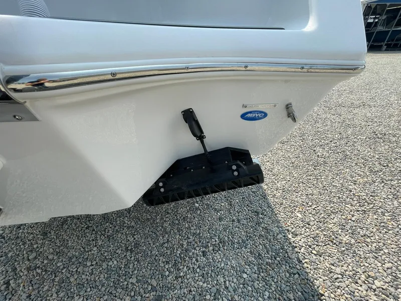 Slide: The Image of 2025 Tidewater 232 CC Adventure boat hull on gravel surface. - 52