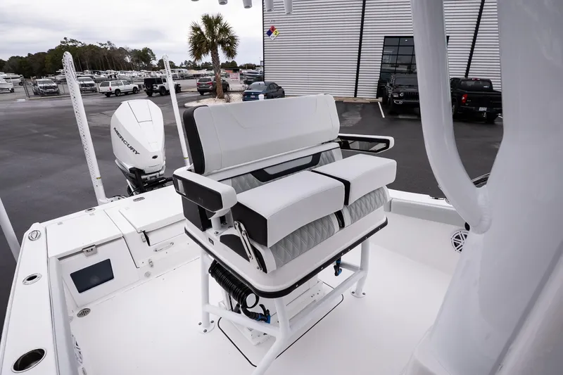 Slide: The Image of 2026 Blackfin 242 HB boat interior with seating and Mercury outboard motor. - 15