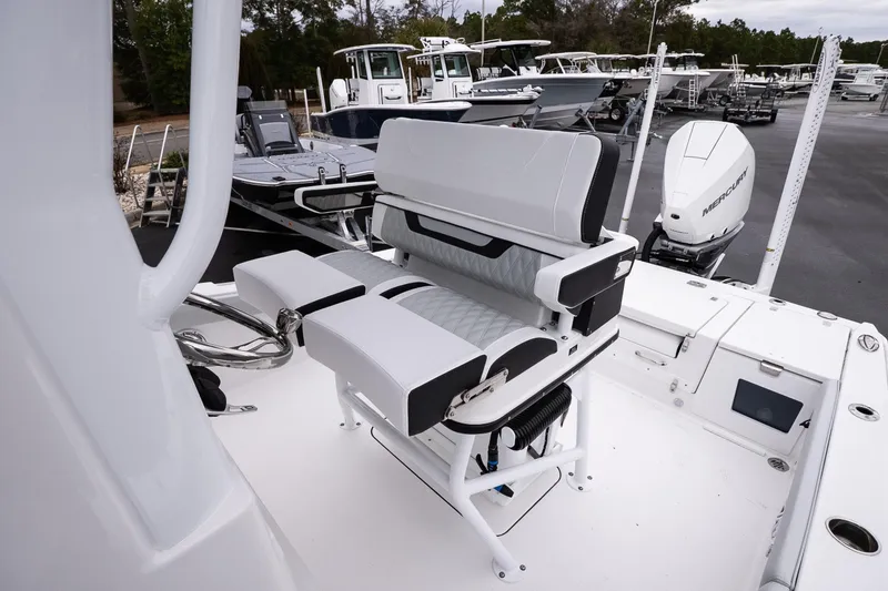 Slide: The Image of 2026 Blackfin 242 HB boat interior with modern seating and Mercury engine. - 16