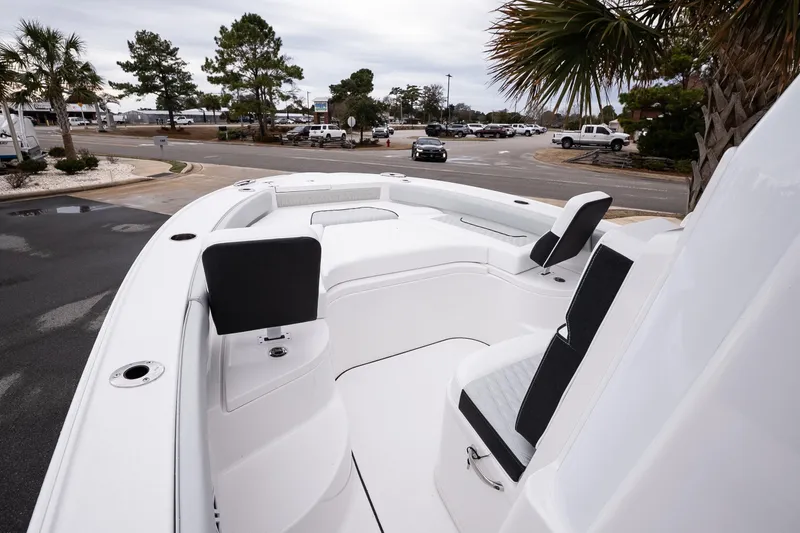 Slide: The Image of 2026 Blackfin 242 HB boat interior with sleek seating and modern design. - 17