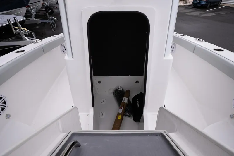Slide: The Image of 2026 Blackfin 242 HB boat interior with storage compartment and sleek design. - 19