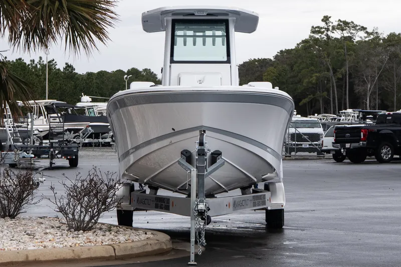 Slide: The Image of 2026 Blackfin 242 HB boat on trailer in parking lot, surrounded by trees and vehicles. - 3