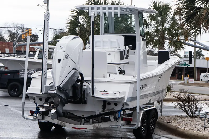 Slide: The Image of 2026 Blackfin 242 HB boat on trailer, parked outdoors near palm trees. - 6