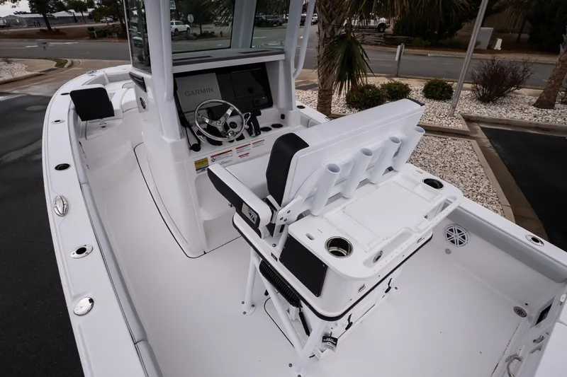 Slide: The Image of 2026 Blackfin 242 HB boat interior with steering console and seating, featuring Garmin electronics. - 8