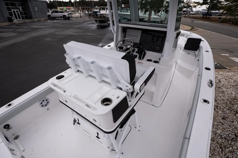 Slide: The Image of 2026 Blackfin 242 HB boat interior with helm, seating, and rod holders. - 9