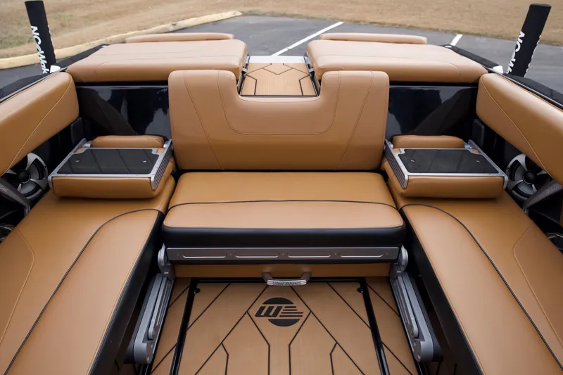 Slide: The Image of 2020 Malibu Wakesetter 24 MXZ interior with tan leather seating and sleek design. - 10