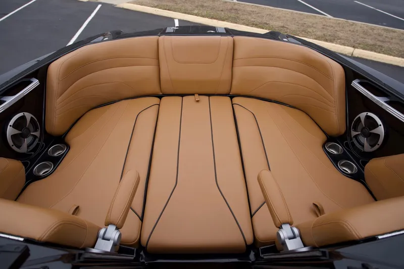Slide: The Image of Luxurious tan seating in 2020 Malibu Wakesetter 24 MXZ boat interior. - 11