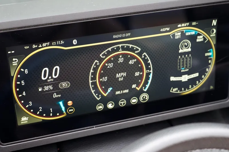 Slide: The Image of 2020 Malibu Wakesetter 24 MXZ dashboard display showing speed, RPM, and fuel levels. - 12