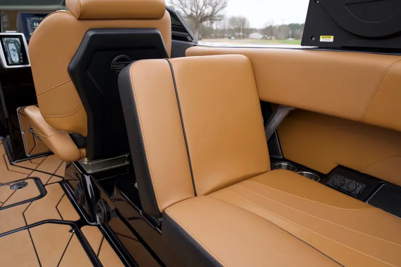 Slide: The Image of 2020 Malibu Wakesetter 24 MXZ interior with tan leather seating and modern design. - 16