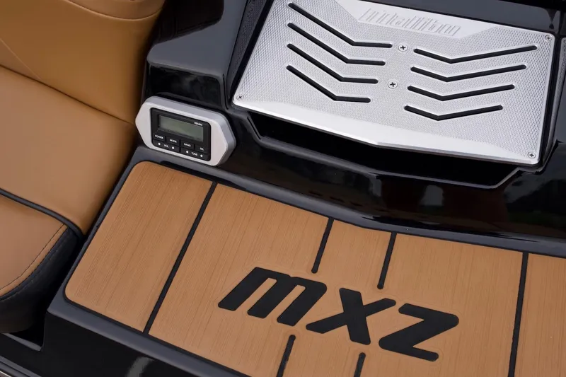 Slide: The Image of 2020 Malibu Wakesetter 24 MXZ interior detail with control panel and MXZ branding. - 20