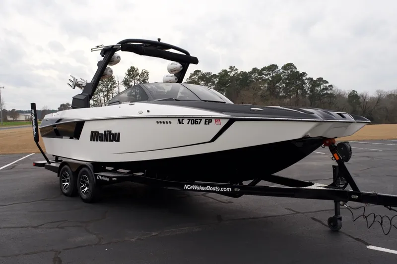 Slide: The Image of 2020 Malibu Wakesetter 24 MXZ boat on trailer in parking lot. - 4