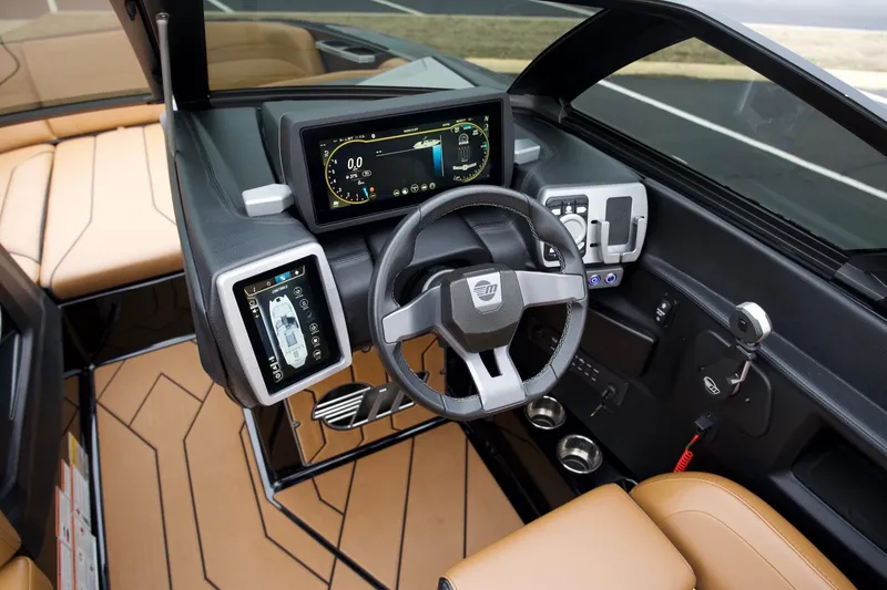 Slide: The Image of 2020 Malibu Wakesetter 24 MXZ dashboard with modern controls and touchscreen displays. - 7