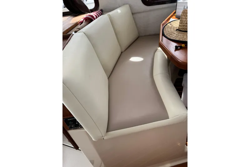 Slide: The Image of Cream-colored seating area on 2009 Ranger Tugs R-29 boat interior. - 12