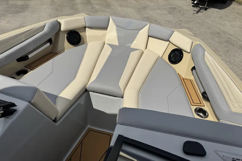 Slide: The Image of 2026 ATX Surf Boats 22 Type-S interior with beige and gray seating, cup holders, and speakers. - 13