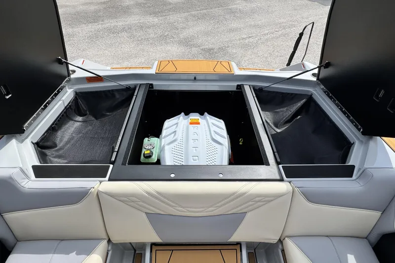 Slide: The Image of 2026 ATX Surf Boats 22 Type-S engine compartment with open hatches and storage space. - 19