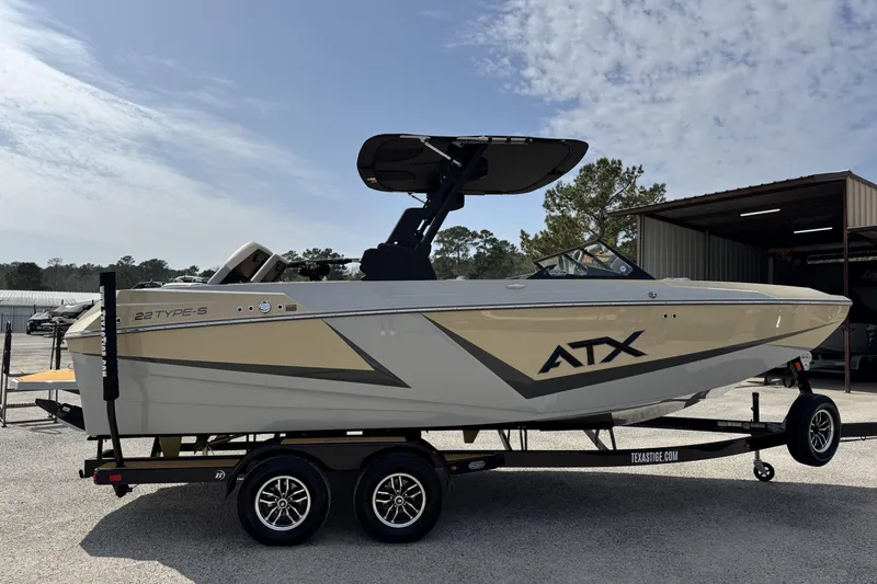 Slide: The Image of 2026 ATX Surf Boats 22 Type-S on trailer, parked outdoors under a clear sky. - 5