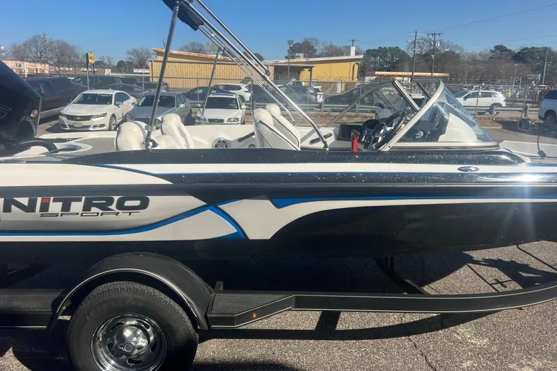 Slide: The Image of 2022 Nitro Z19 Sport boat on trailer in parking lot, side view. - 12