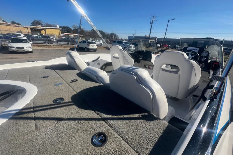 Slide: The Image of 2022 Nitro Z19 Sport boat interior with plush seating and modern dashboard. - 20