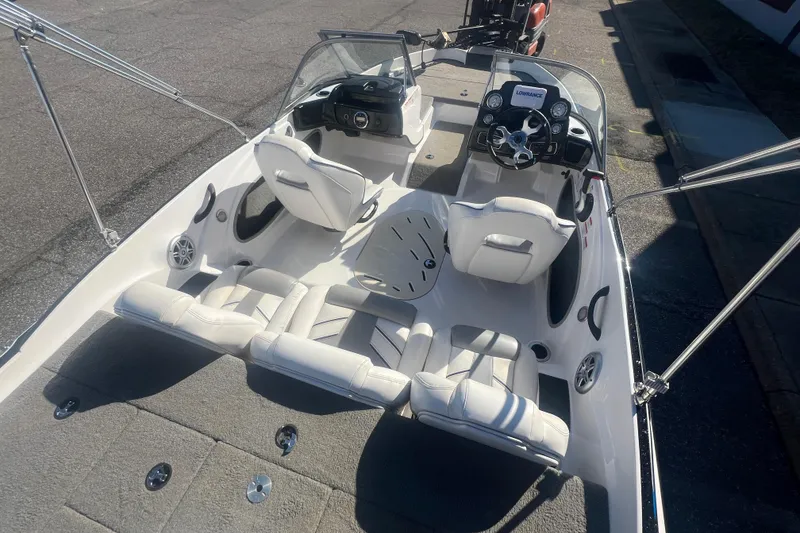 Slide: The Image of 2022 Nitro Z19 Sport boat interior with white seating and modern dashboard. - 21