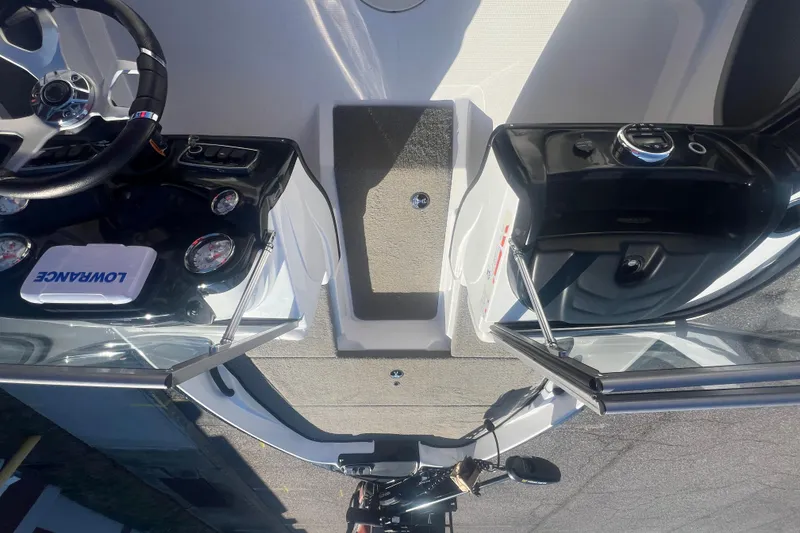 Slide: The Image of 2022 Nitro Z19 Sport boat dashboard with steering wheel and Lowrance electronics. - 23
