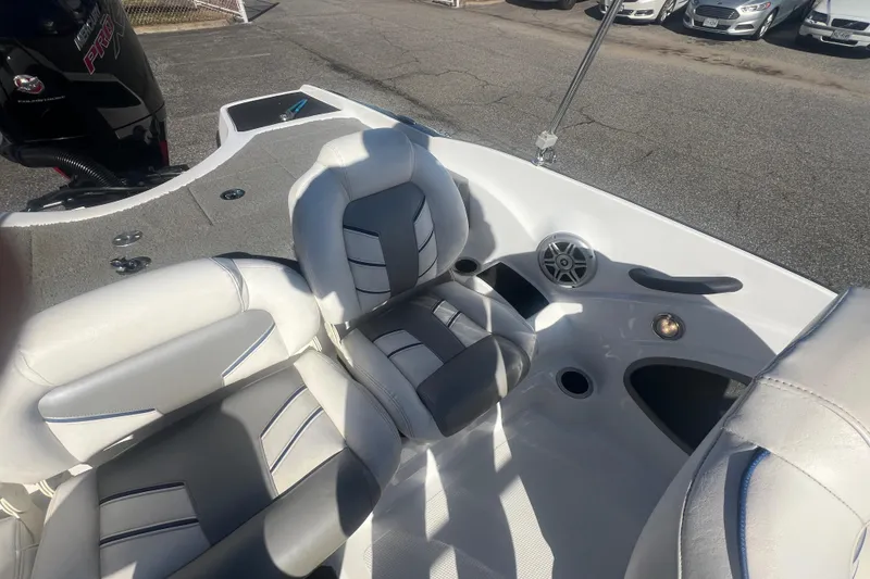 Slide: The Image of 2022 Nitro Z19 Sport boat interior with cushioned seating and speaker system. - 28