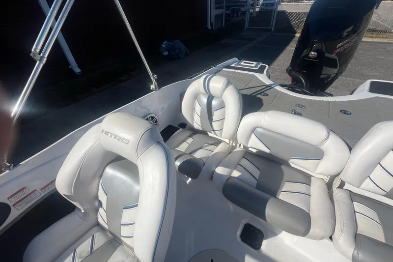 Slide: The Image of 2022 Nitro Z19 Sport boat interior with white and gray seating. - 29
