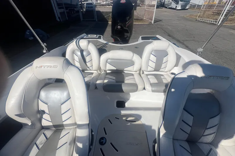 Slide: The Image of 2022 Nitro Z19 Sport boat interior with white and gray seating. - 30