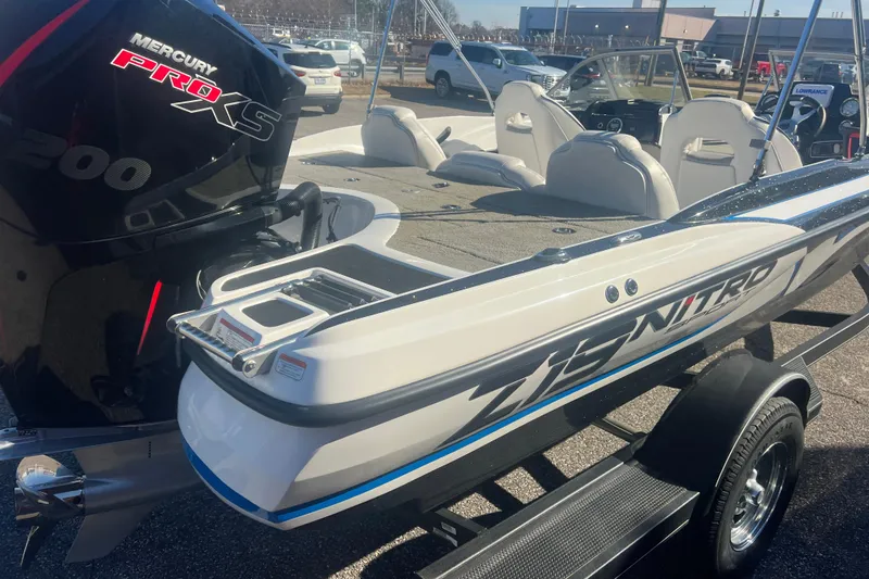Slide: The Image of 2022 Nitro Z19 Sport boat with Mercury Pro XS engine, parked on a trailer. - 9