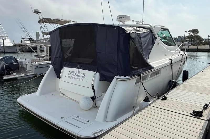 Slide: The Image of 2007 Tiara Yachts 3900 Sovran docked, featuring a covered stern and sleek design. - 0