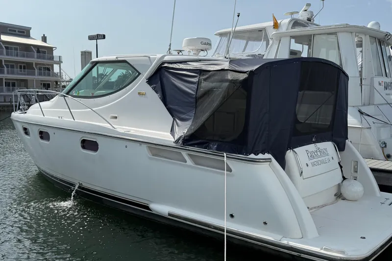 Slide: The Image of 2007 Tiara Yachts 3900 Sovran docked at marina with covered cockpit. - 1