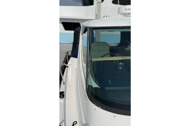 Slide: The Image of 2007 Tiara Yachts 3900 Sovran, close-up of cockpit and windshield. - 10