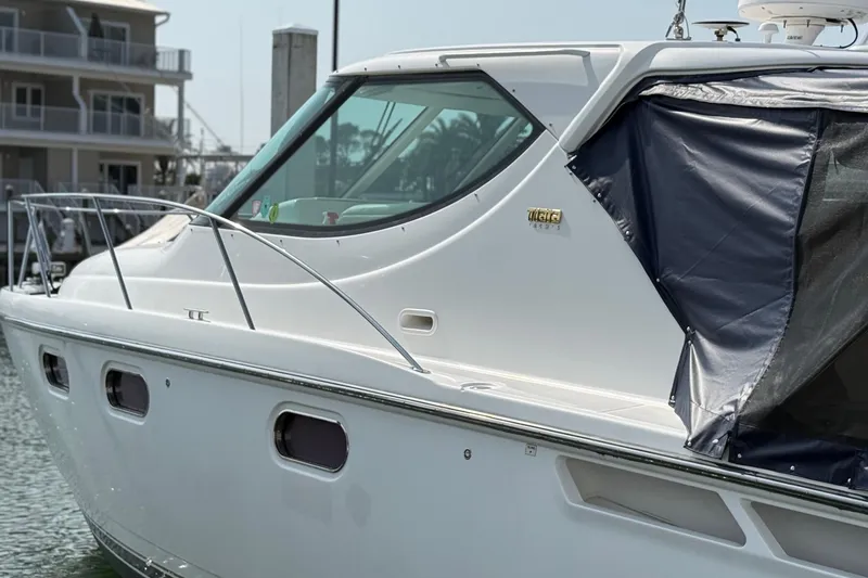 Slide: The Image of 2007 Tiara Yachts 3900 Sovran docked, showcasing sleek design and modern features. - 2