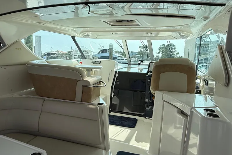 Slide: The Image of Interior of a 2007 Tiara Yachts 3900 Sovran, featuring luxurious seating and helm. - 20