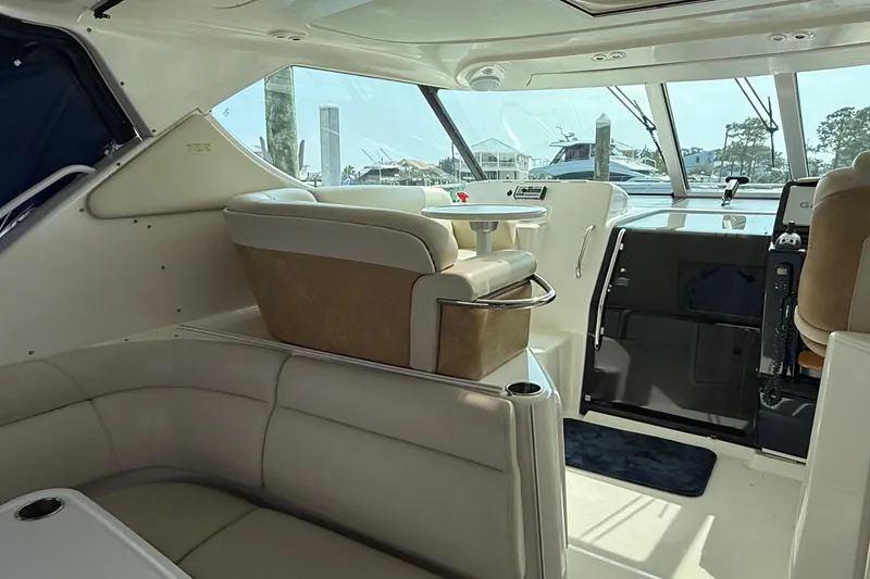 Slide: The Image of Interior of 2007 Tiara Yachts 3900 Sovran, featuring plush seating and helm station. - 21