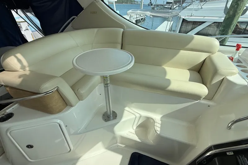 Slide: The Image of Luxurious seating area on a 2007 Tiara Yachts 3900 Sovran with a small table. - 24