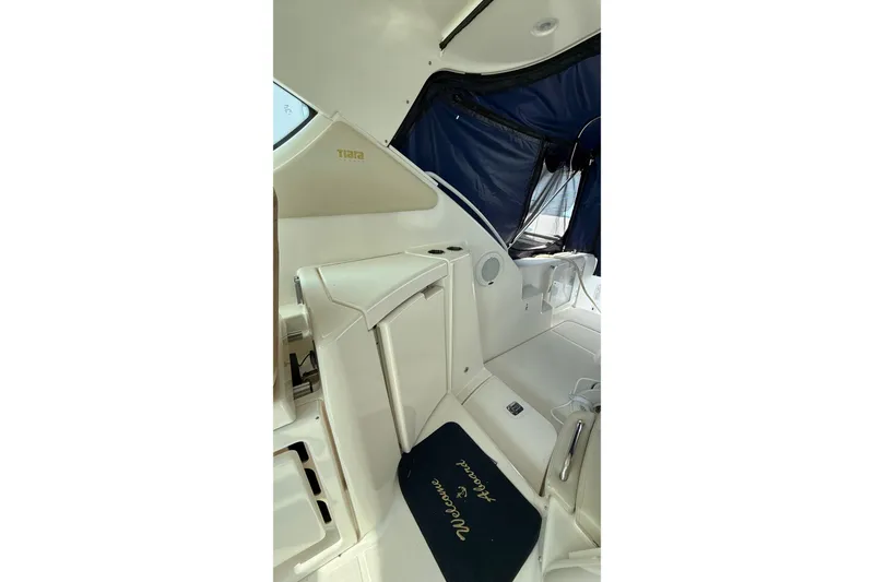 Slide: The Image of Interior of 2007 Tiara Yachts 3900 Sovran with seating and "Welcome Aboard" mat. - 26