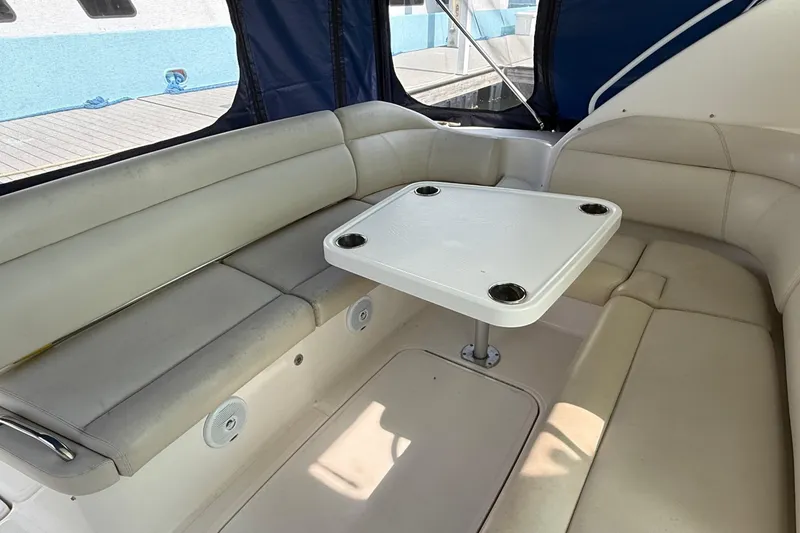Slide: The Image of 2007 Tiara Yachts 3900 Sovran interior with cushioned seating and table. - 27