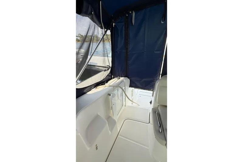 Slide: The Image of 2007 Tiara Yachts 3900 Sovran interior with blue canopy and white seating. - 29