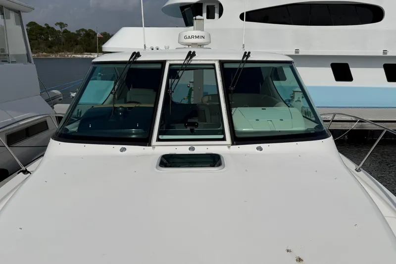 Slide: The Image of 2007 Tiara Yachts 3900 Sovran with Garmin equipment, docked near other boats. - 3