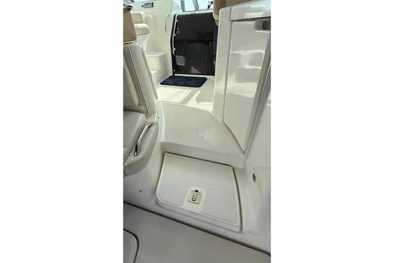 Slide: The Image of Interior view of 2007 Tiara Yachts 3900 Sovran, showcasing sleek white seating and flooring. - 32