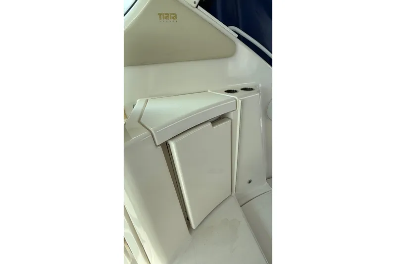 Slide: The Image of 2007 Tiara Yachts 3900 Sovran interior detail with storage compartment and cup holders. - 35