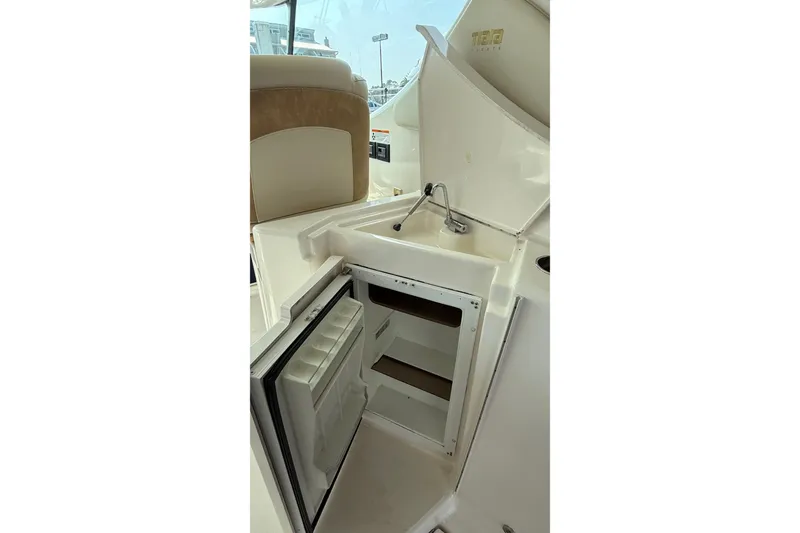 Slide: The Image of 2007 Tiara Yachts 3900 Sovran interior with sink and open mini fridge. - 36