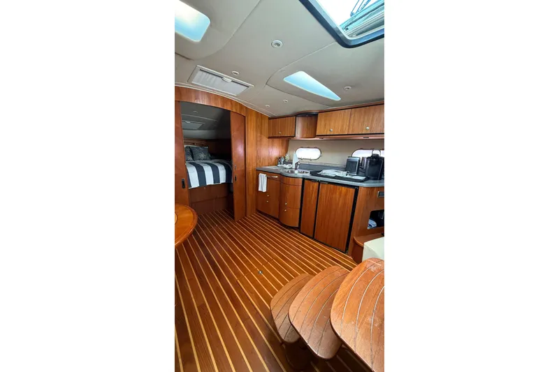 Slide: The Image of Interior of 2007 Tiara Yachts 3900 Sovran, featuring wood finishes and modern amenities. - 37