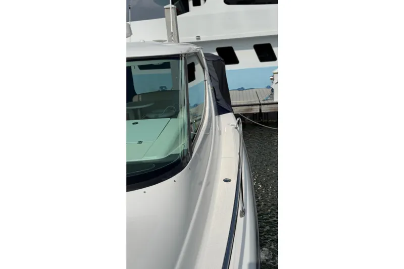 Slide: The Image of 2007 Tiara Yachts 3900 Sovran docked, showcasing sleek design and modern features. - 4