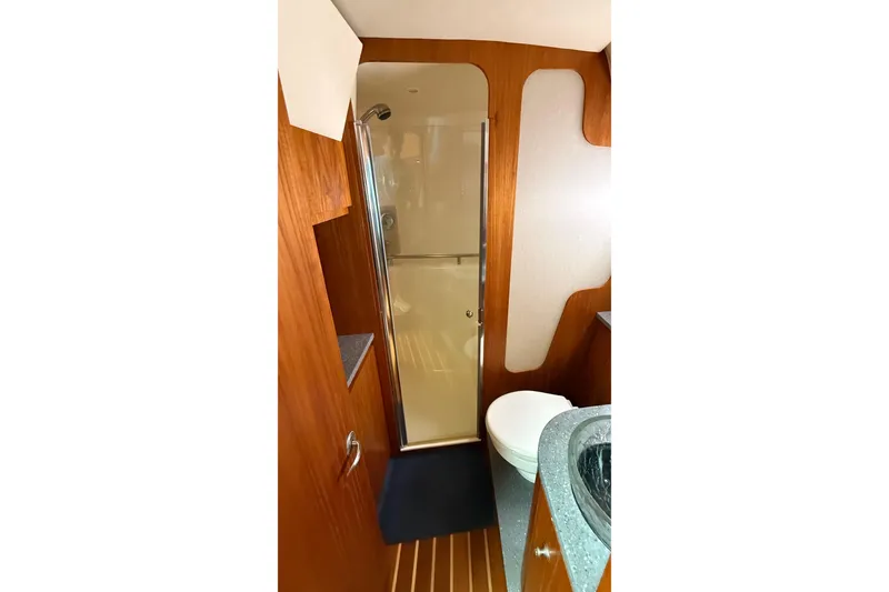 Slide: The Image of Luxurious bathroom in 2007 Tiara Yachts 3900 Sovran with wood accents and modern fixtures. - 51