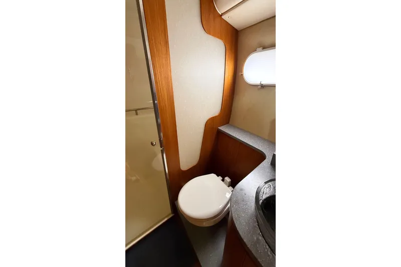 Slide: The Image of 2007 Tiara Yachts 3900 Sovran bathroom with modern fixtures and wood accents. - 52
