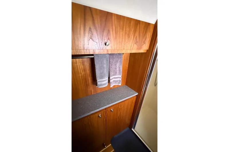 Slide: The Image of 2007 Tiara Yachts 3900 Sovran interior with wooden cabinetry and towel rack. - 53