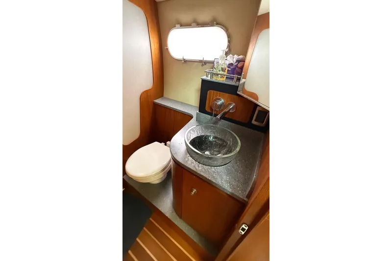 Slide: The Image of 2007 Tiara Yachts 3900 Sovran bathroom with modern sink and toilet. - 54